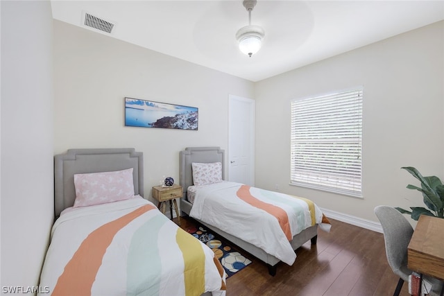 bedroom with dark wood-type flooring and ceiling fan