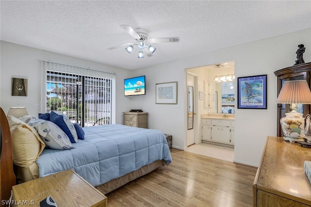 bedroom with light hardwood / wood-style floors, a textured ceiling, access to outside, ensuite bath, and ceiling fan