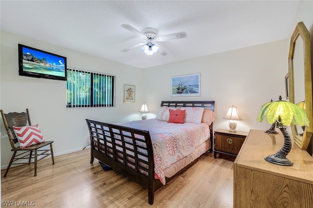 bedroom featuring ceiling fan and light hardwood / wood-style floors