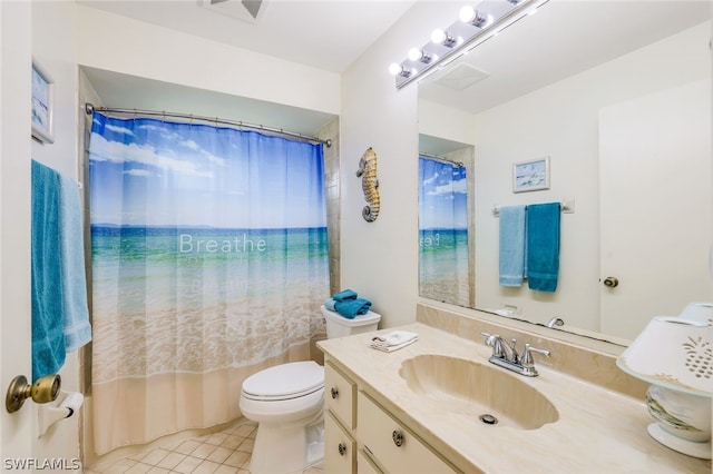 full bathroom featuring tile patterned floors, shower / bath combo with shower curtain, vanity, and toilet