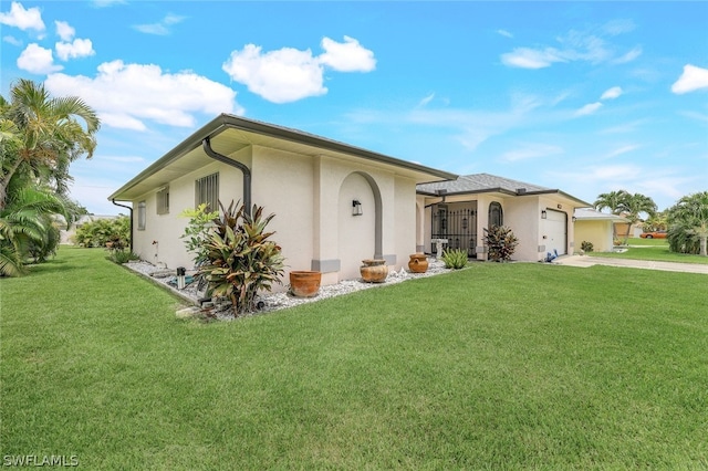 ranch-style house with a front yard and a garage