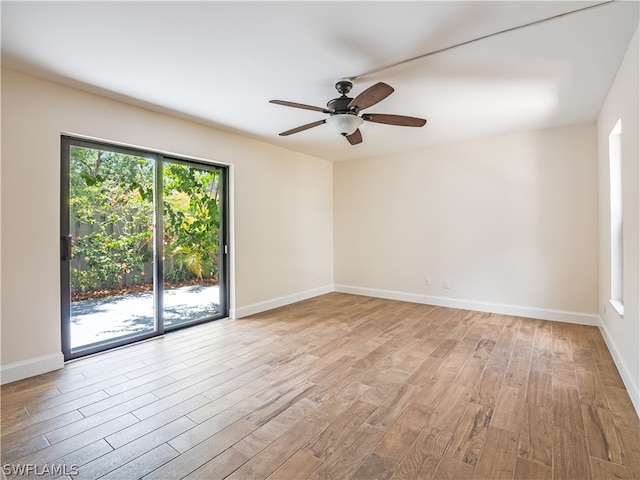 empty room featuring light hardwood / wood-style flooring and ceiling fan