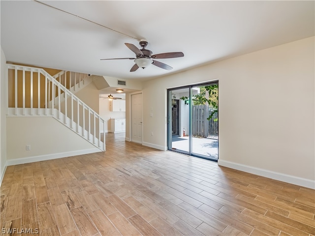 unfurnished room featuring light wood-type flooring and ceiling fan