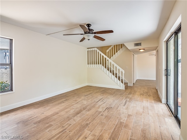 empty room featuring ceiling fan and light hardwood / wood-style flooring