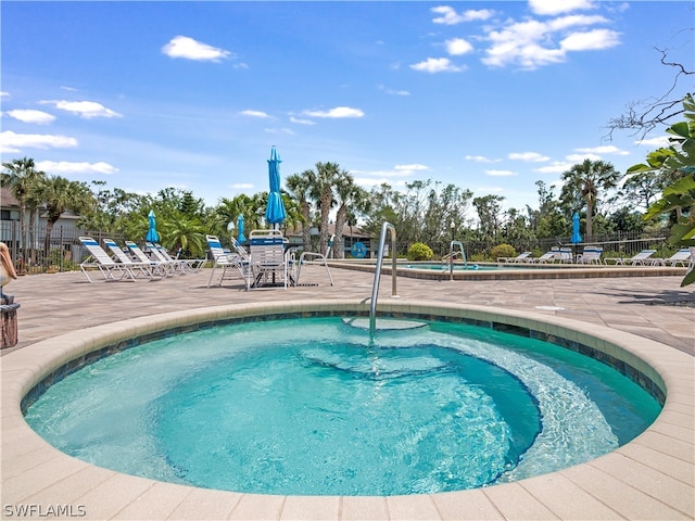 view of swimming pool featuring a patio area