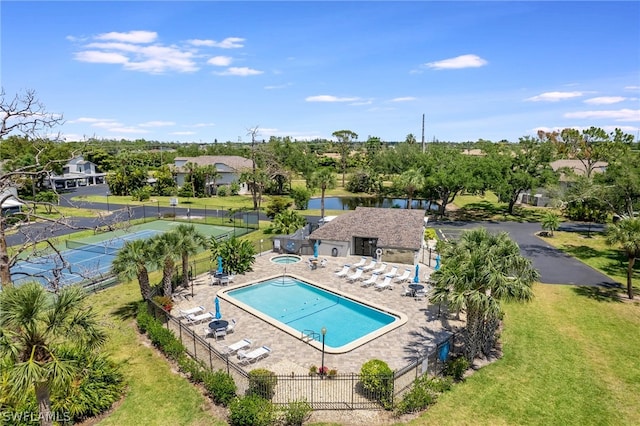 view of pool featuring a yard