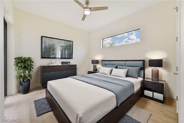 bedroom featuring ceiling fan and light hardwood / wood-style floors