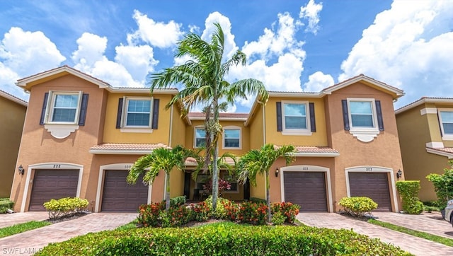 townhome / multi-family property featuring a garage