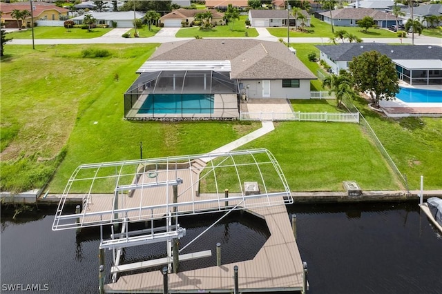 dock area with glass enclosure and a water view