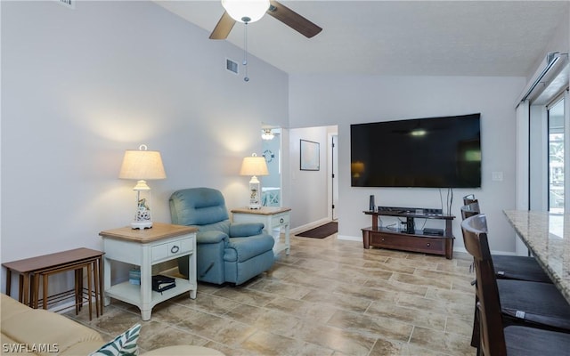 living room with vaulted ceiling and ceiling fan