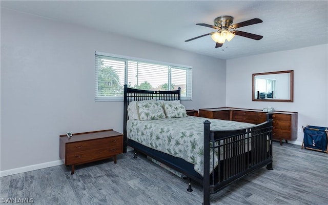 bedroom featuring ceiling fan and hardwood / wood-style flooring