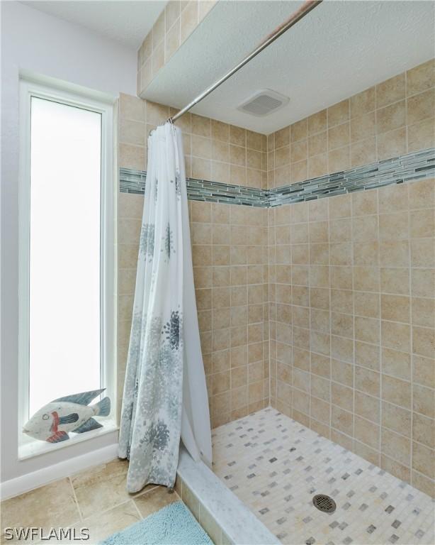 bathroom featuring a shower with curtain