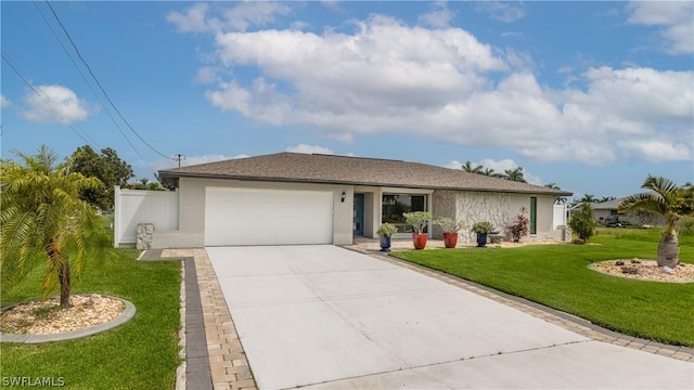 ranch-style house featuring a garage and a front yard