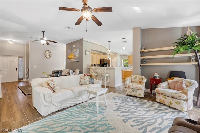 living room featuring light hardwood / wood-style flooring and ceiling fan