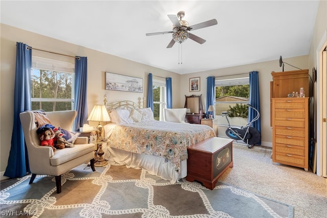 bedroom with light colored carpet and ceiling fan