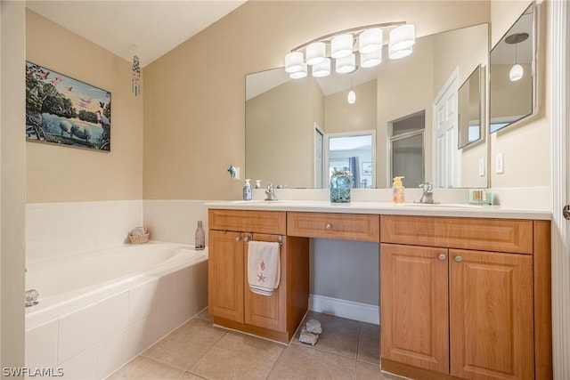 bathroom with tile patterned flooring, tiled bath, lofted ceiling, and dual bowl vanity