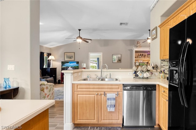 kitchen with stainless steel dishwasher, ceiling fan, black fridge, sink, and kitchen peninsula