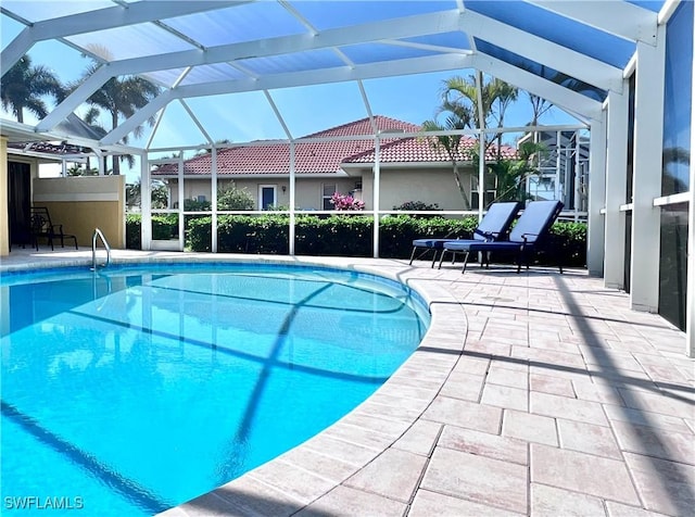 view of pool featuring a lanai and a patio area