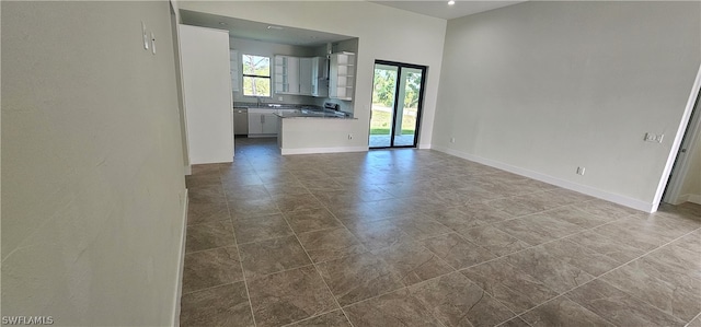 tiled spare room with sink