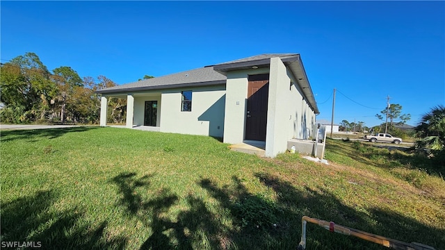 back of house with a yard