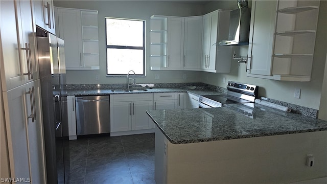 kitchen featuring white cabinetry, stainless steel appliances, wall chimney exhaust hood, and sink