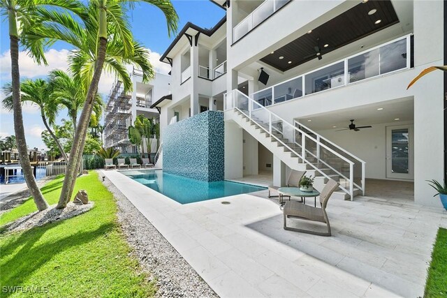 175 Conners Ave, Naples, FL 34108 - outdoor pool featuring stairs, ceiling fan, and a patio