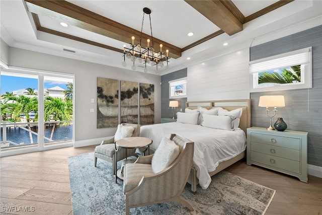 bedroom featuring access to outside, a water view, light hardwood / wood-style flooring, a notable chandelier, and beam ceiling