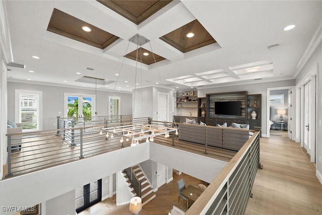 interior space with crown molding, beamed ceiling, coffered ceiling, and light wood-type flooring