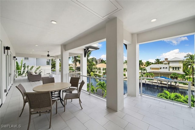 view of patio with a water view