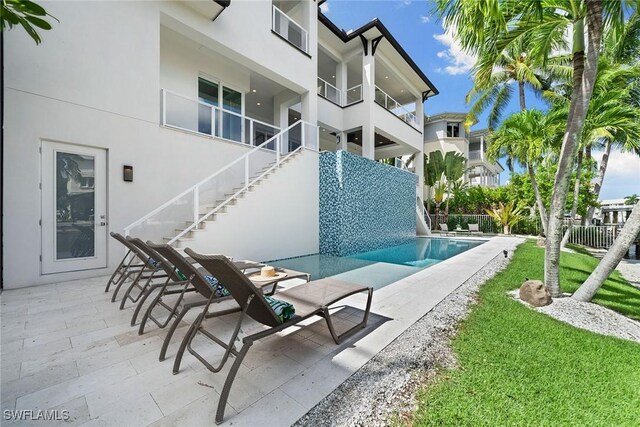 175 Conners Ave, Naples, FL 34108 - view of swimming pool featuring stairs and a patio area