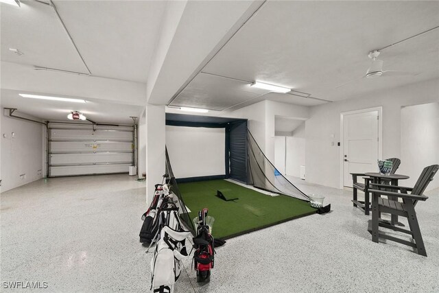 175 Conners Ave, Naples, FL 34108 - recreation room featuring speckled floor and golf simulator