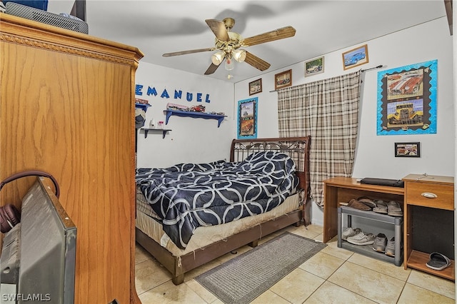 bedroom with tile patterned flooring and ceiling fan