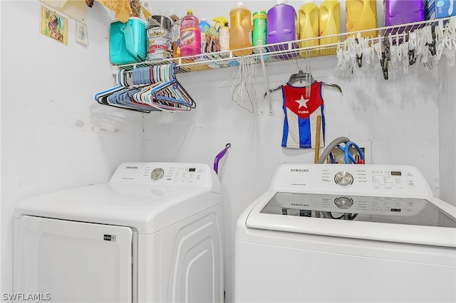 laundry room with separate washer and dryer