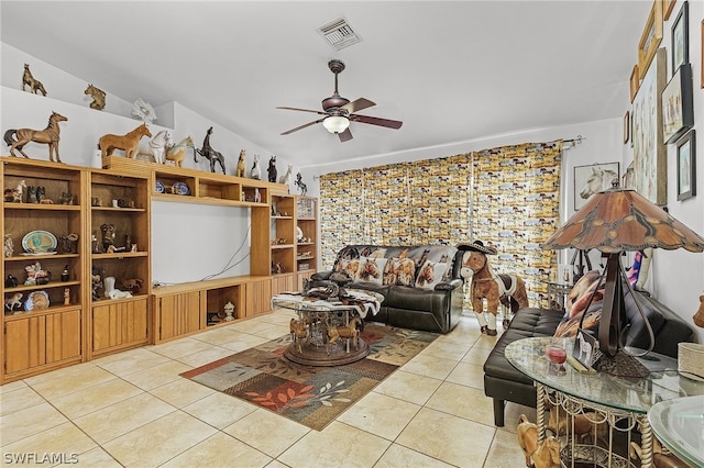 tiled living room featuring ceiling fan