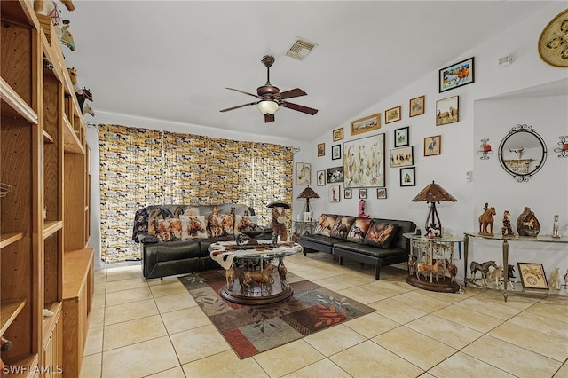 living room featuring light tile patterned flooring, ceiling fan, and lofted ceiling