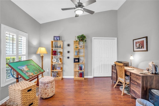 office space with ceiling fan, vaulted ceiling, and dark hardwood / wood-style flooring