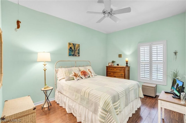 bedroom featuring ceiling fan and hardwood / wood-style flooring