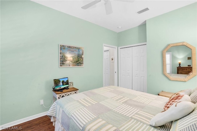 bedroom featuring ceiling fan, hardwood / wood-style floors, and a closet