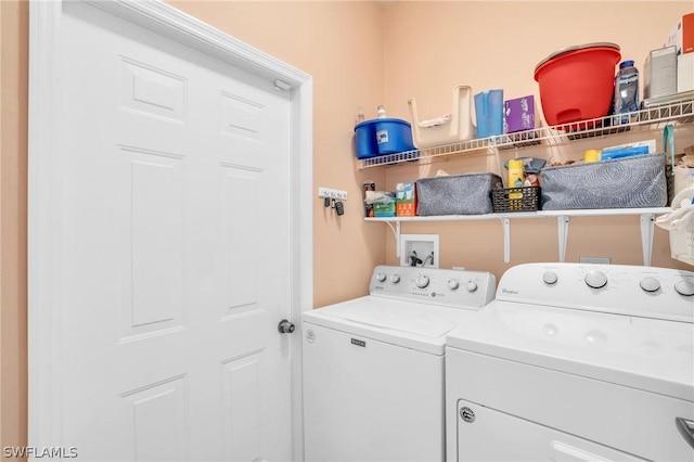 clothes washing area featuring washing machine and dryer