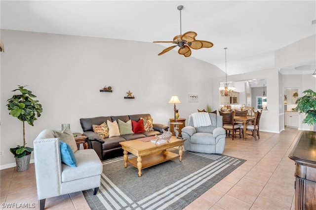 living room with vaulted ceiling, light tile patterned floors, and ceiling fan with notable chandelier