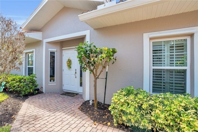 doorway to property with a patio