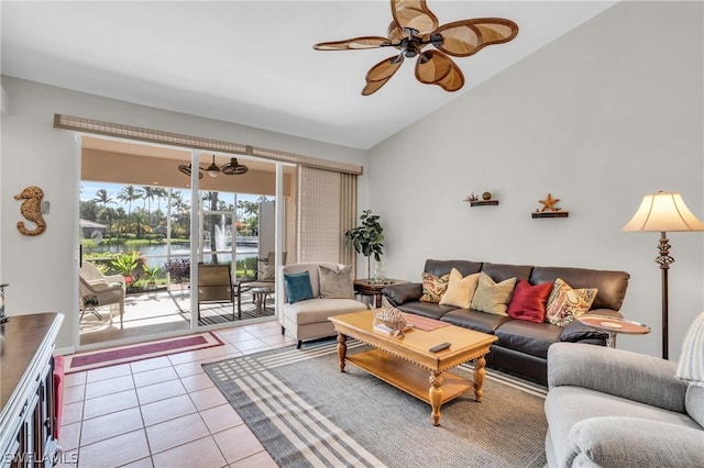 tiled living room featuring ceiling fan and lofted ceiling