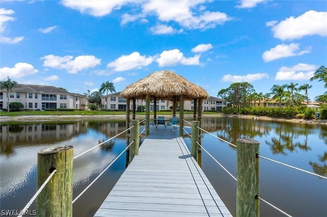 view of dock with a water view and a gazebo