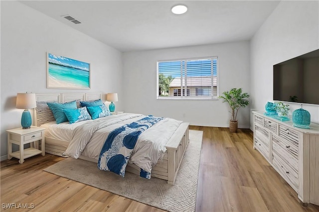 bedroom with light hardwood / wood-style floors