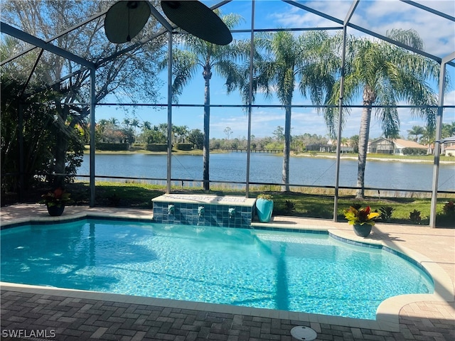 view of swimming pool featuring pool water feature and a lanai