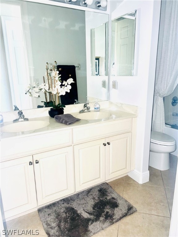 full bathroom with tile patterned floors, toilet, shower / bathtub combination, and dual bowl vanity