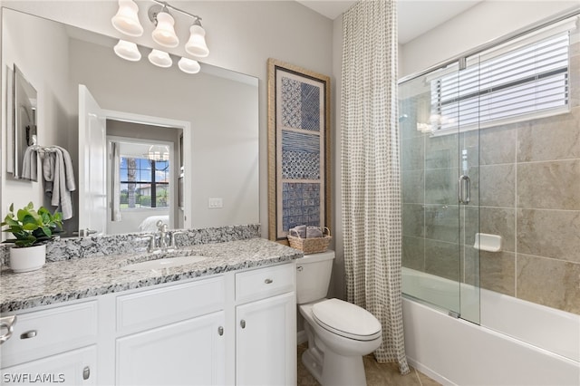 full bathroom featuring toilet, vanity, and shower / bath combination with glass door