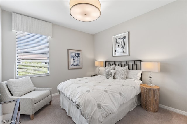 bedroom with light colored carpet