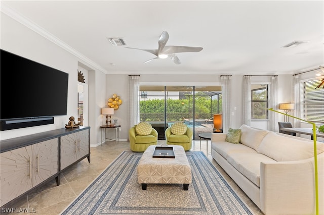 living room with ceiling fan, light tile patterned flooring, and crown molding