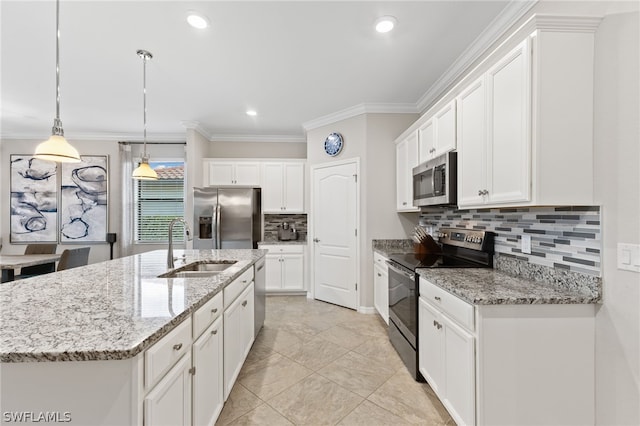 kitchen featuring decorative backsplash, sink, white cabinetry, and appliances with stainless steel finishes